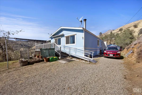 a view of a car park in front of house