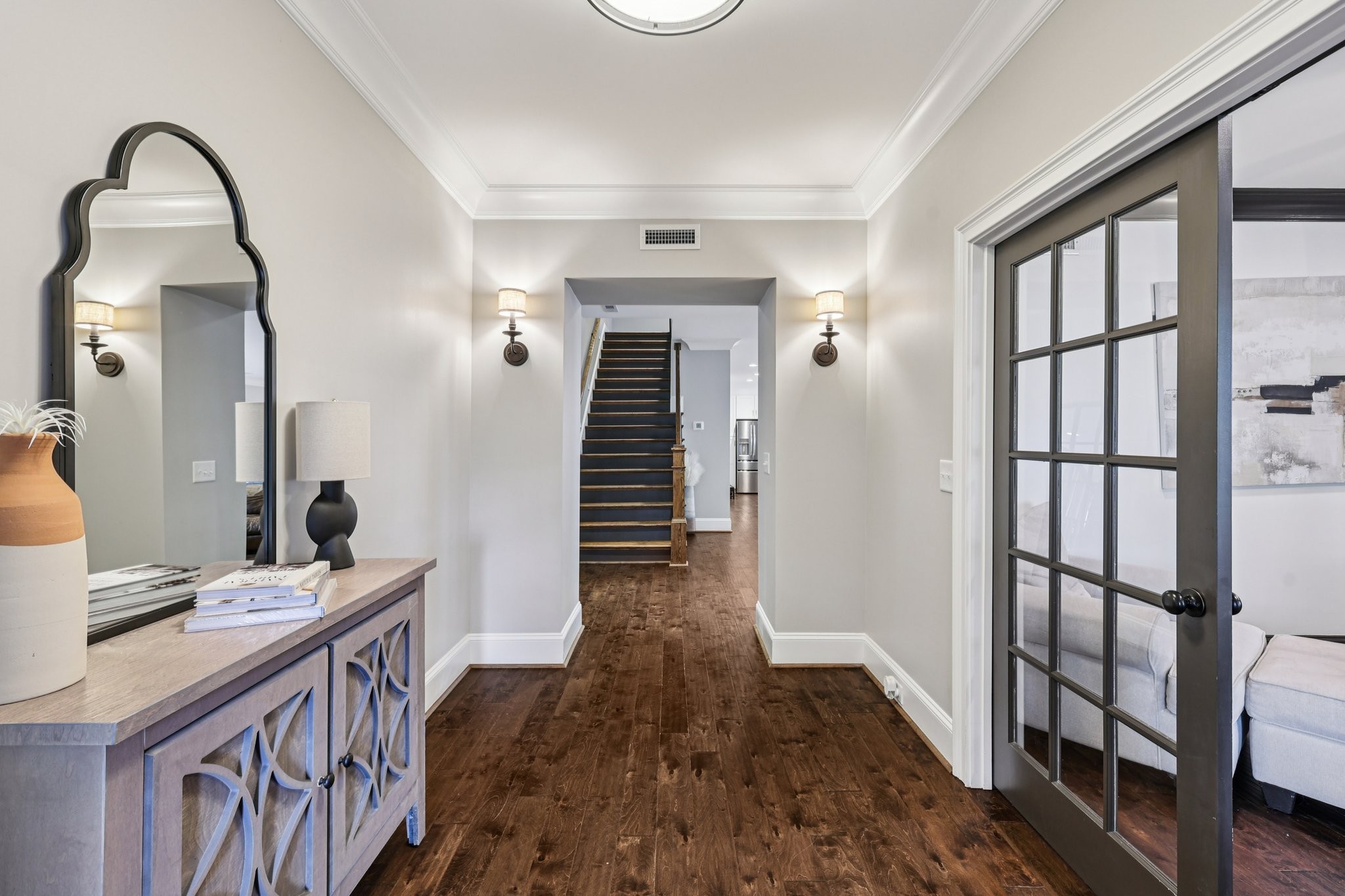 4129 River Links Drive Spring Hill, TN 37174 - Photo 11 of 33 a view of a hallway with wooden floor and staircase