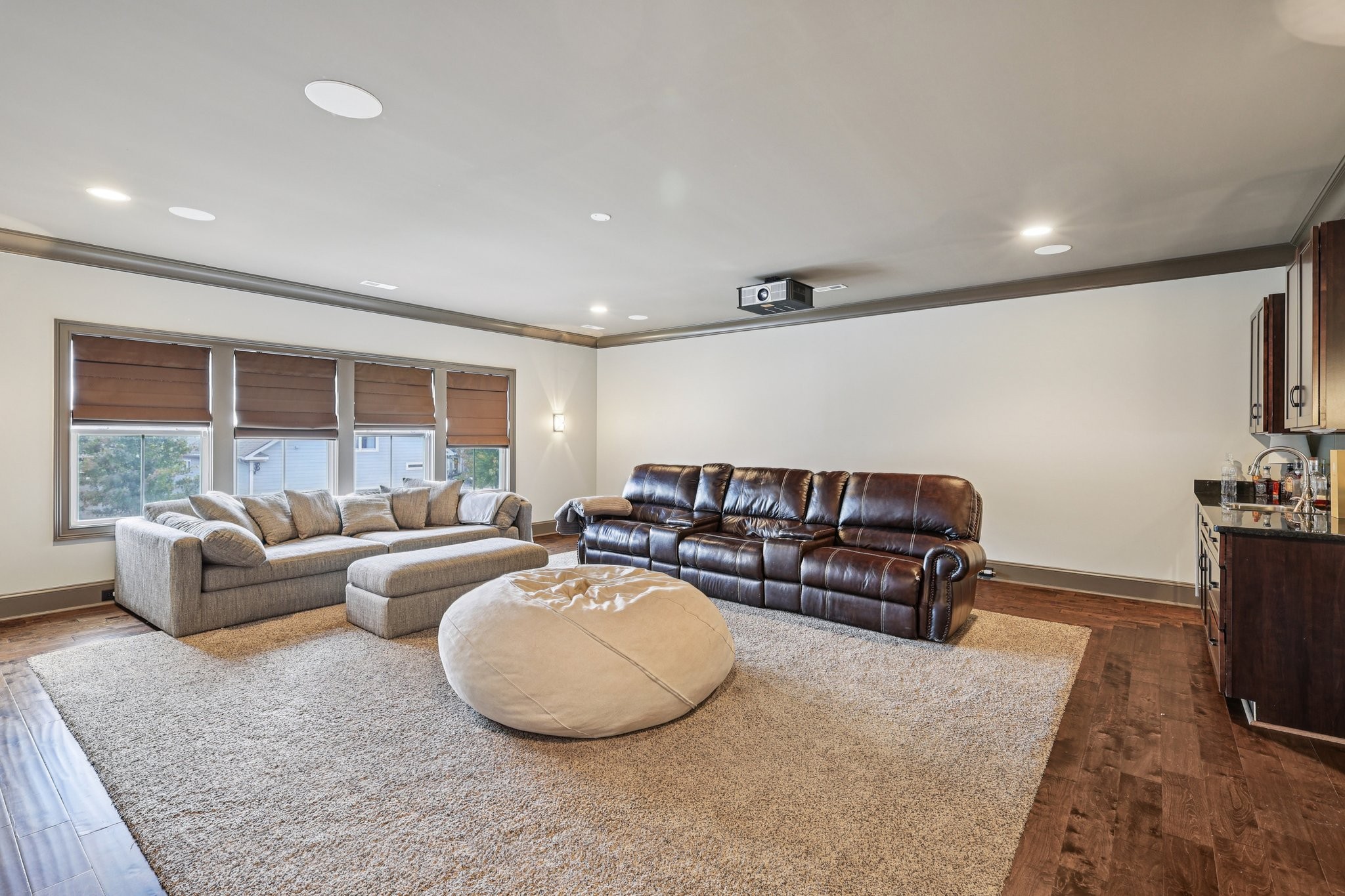 4129 River Links Drive Spring Hill, TN 37174 - Photo 13 of 33 a living room with furniture a flat screen tv and a large window