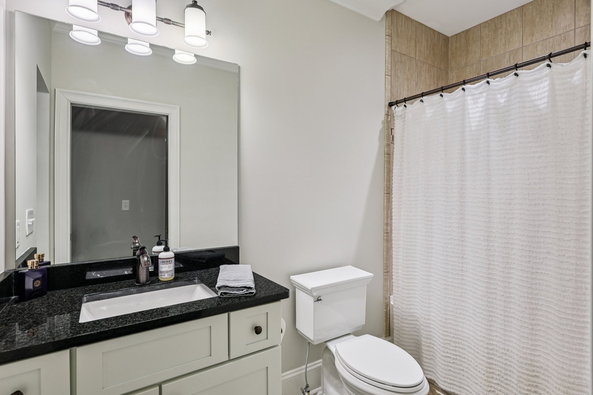 4129 River Links Drive Spring Hill, TN 37174 - Photo 19 of 33 a bathroom with a granite countertop sink mirror vanity and toilet