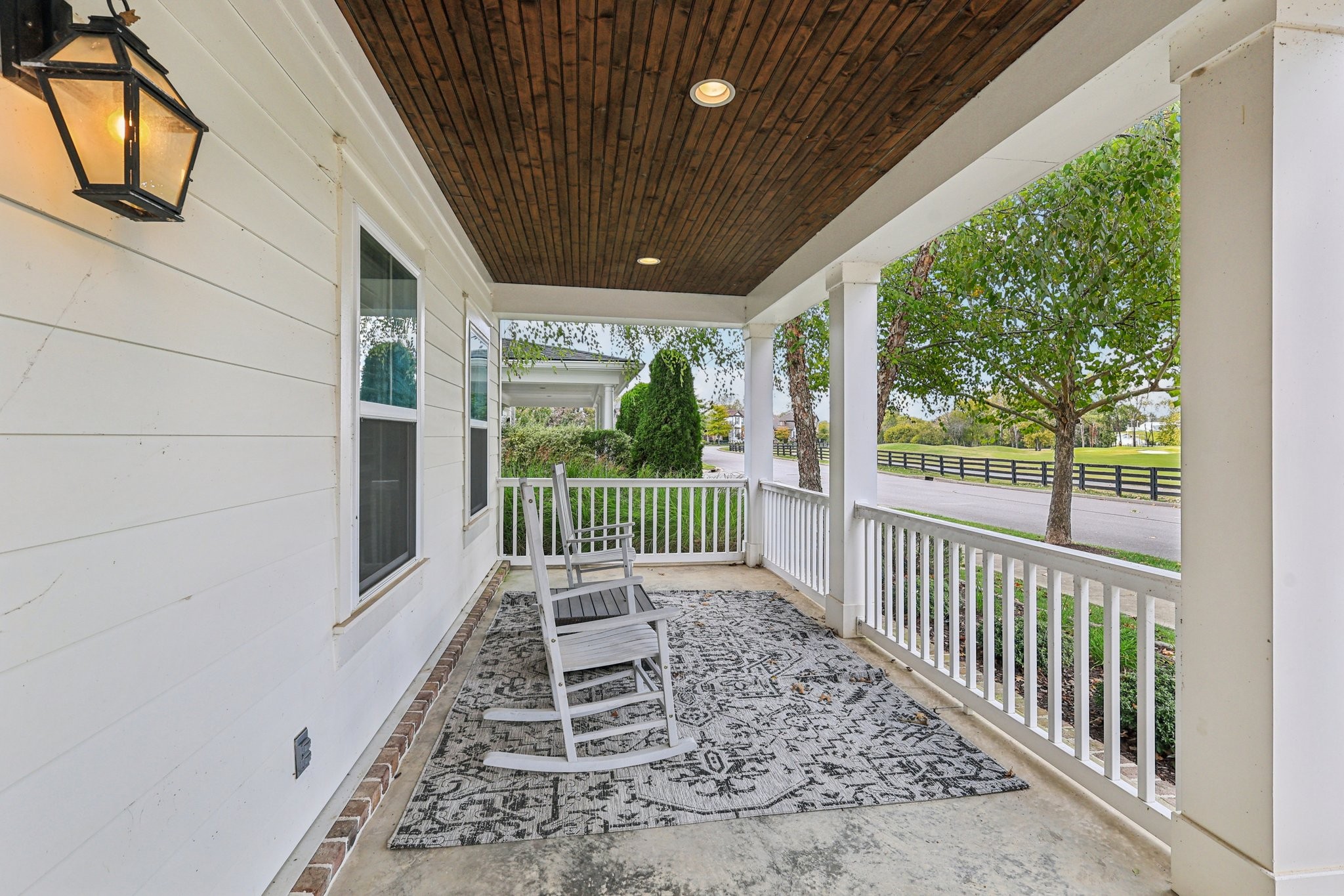 4129 River Links Drive Spring Hill, TN 37174 - Photo 2 of 33 a view of a porch with wooden floor and furniture