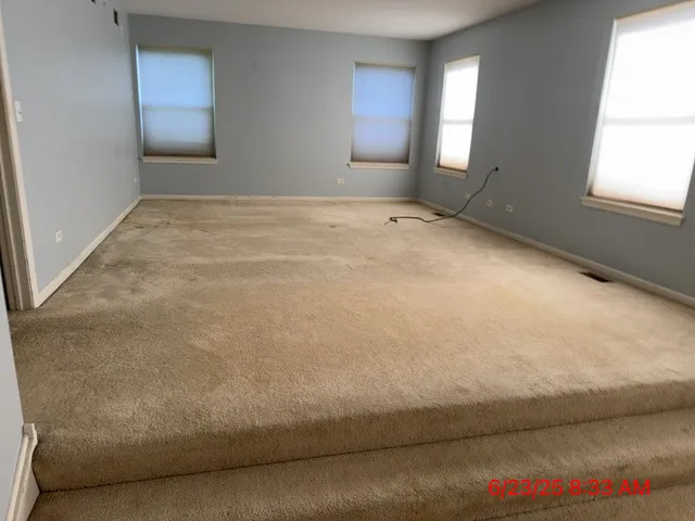 a view of an empty room and window