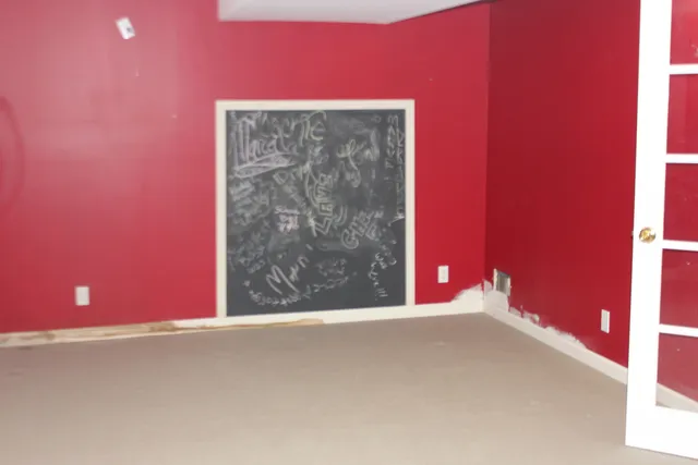 a view of a red door and chair