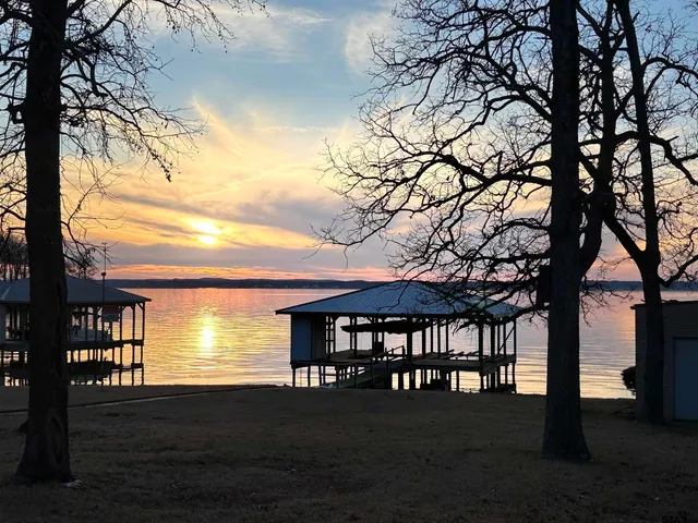 a living room with wooden floor and furniture