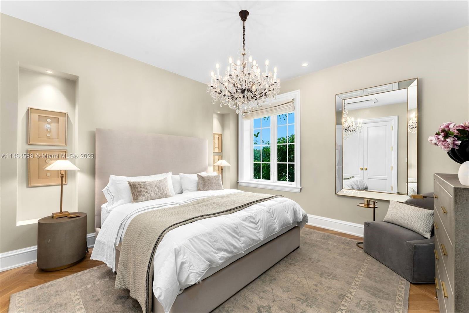 6232 Hancock Road Southwest Ranches, FL 33330 - Photo 18 of 33 a spacious bedroom with a bed and a chandelier
