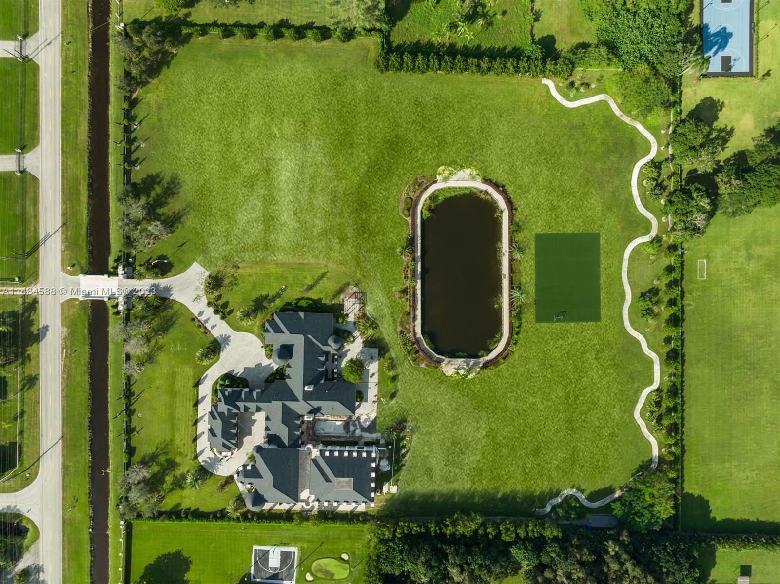 6232 Hancock Road Southwest Ranches, FL 33330 - Photo 32 of 33 an aerial view of a swimming pool