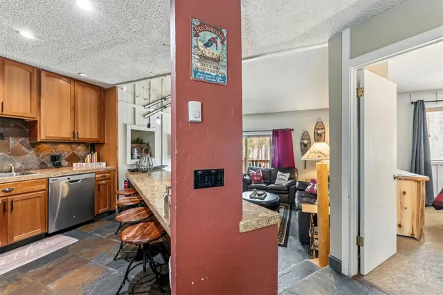 a view of a kitchen with furniture and a kitchen