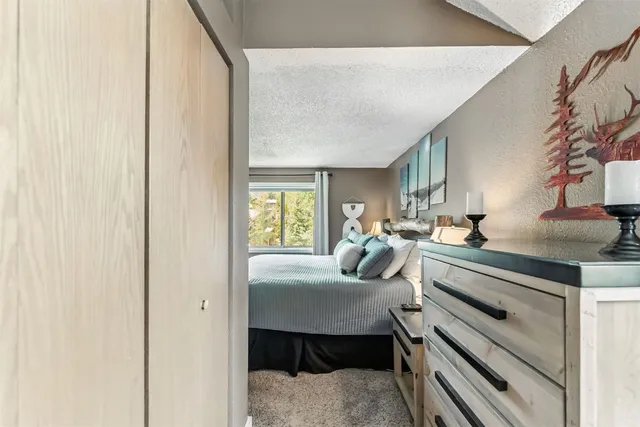 a bedroom with furniture and a window