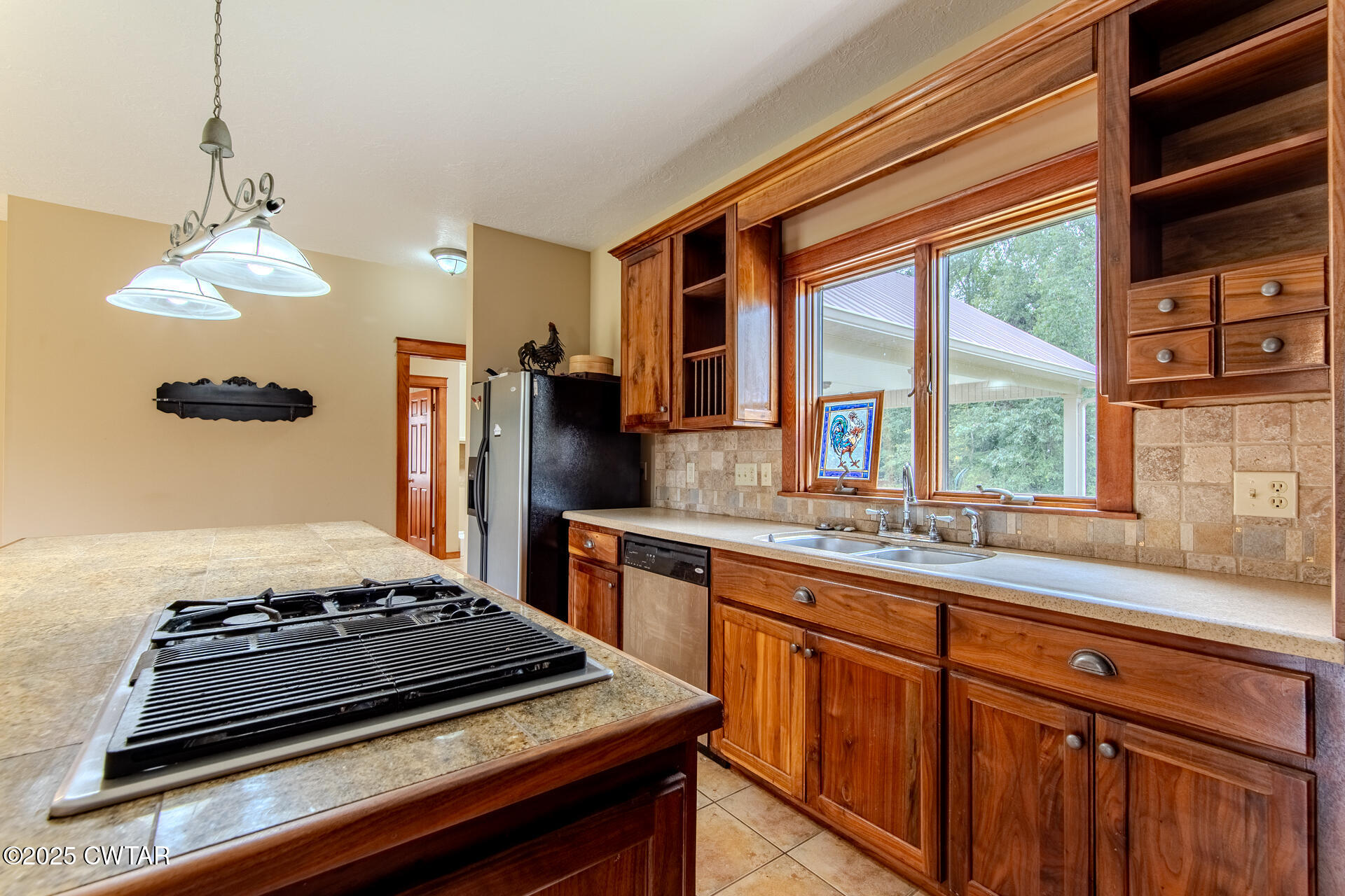 3554 Shades Bridge Road Greenfield, TN 38230 - Photo 12 of 49 a kitchen with stainless steel appliances granite countertop a stove and a refrigerator