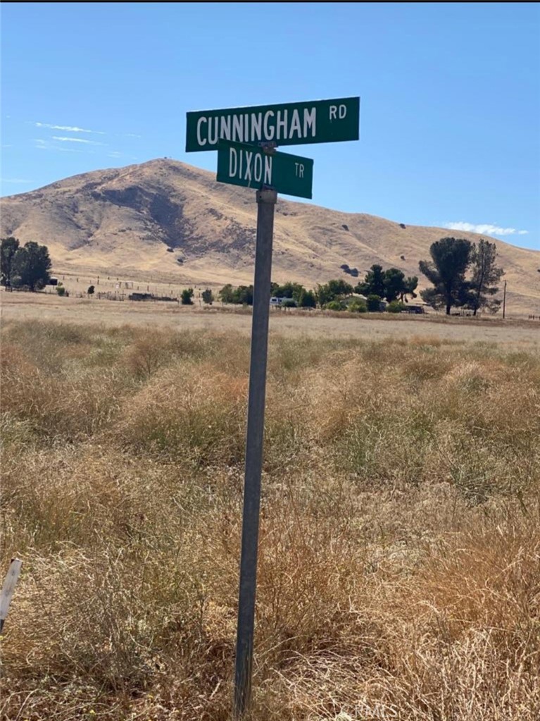 a street sign sitting on top of a road