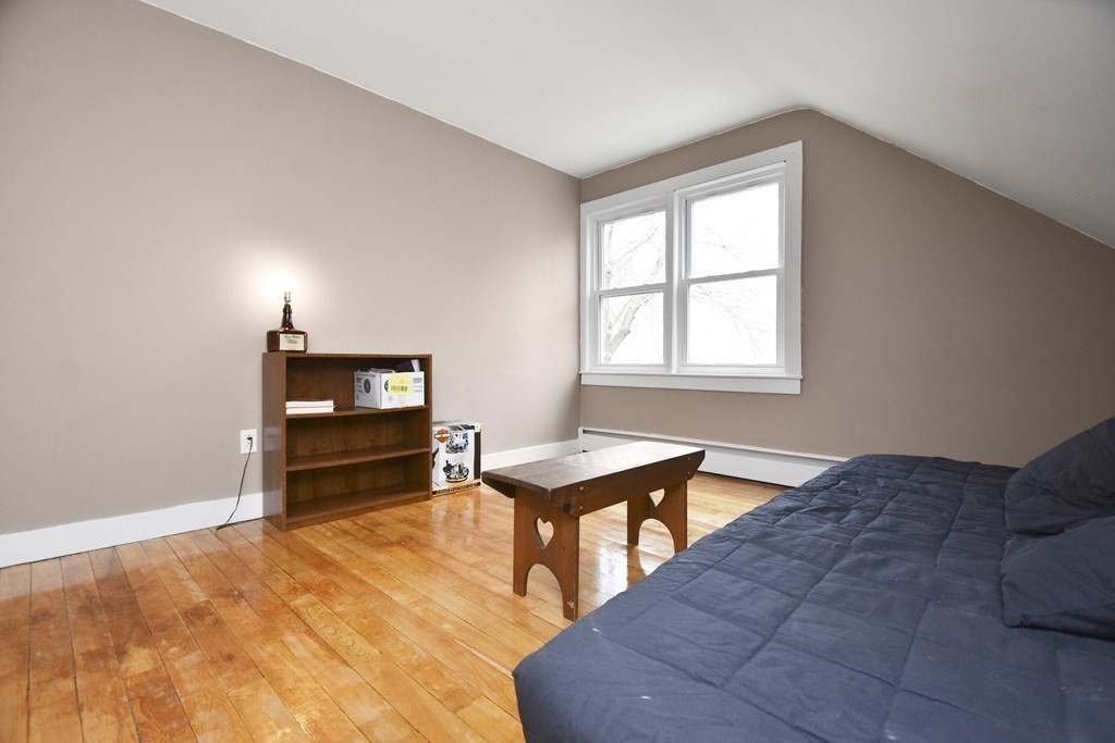 229 Whalom Road Lunenburg, MA 01462 - Photo 18 of 30 a bedroom with furniture and a flat screen tv