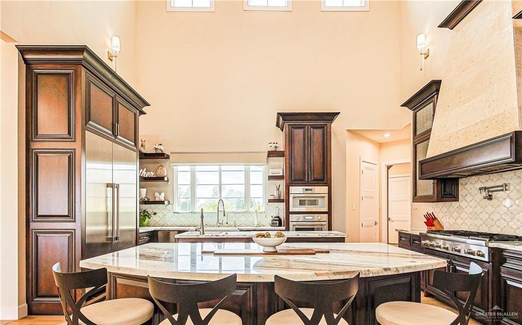 4835 Bryan Road Palmhurst, TX 78573 - Photo 20 of 45 a view of a dining room with furniture window and wooden floor