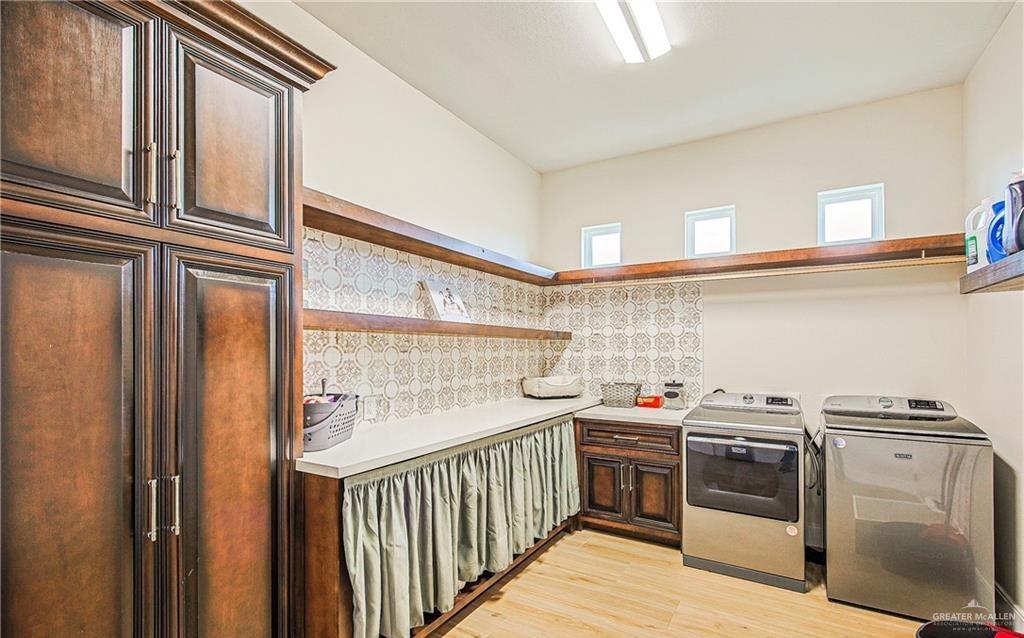4835 Bryan Road Palmhurst, TX 78573 - Photo 24 of 45 a kitchen with stainless steel appliances granite countertop a stove and a refrigerator
