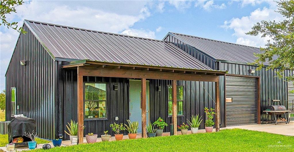 4835 Bryan Road Palmhurst, TX 78573 - Photo 41 of 45 a front view of a house with garden