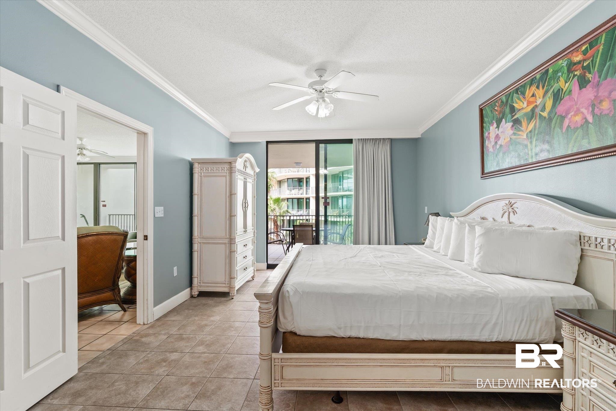 27580 Canal Road, Unit 1322 Orange Beach, AL 36561 - Photo 13 of 30 Bedroom with a textured ceiling, access to exterior, ceiling fan, and ornamental molding