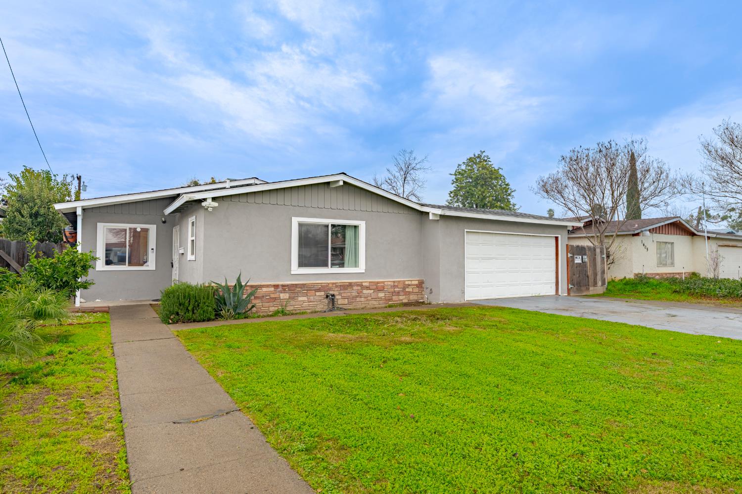 1595 East 26th Street Merced, CA 95340 - Photo 1 of 34 a view of a house with a yard