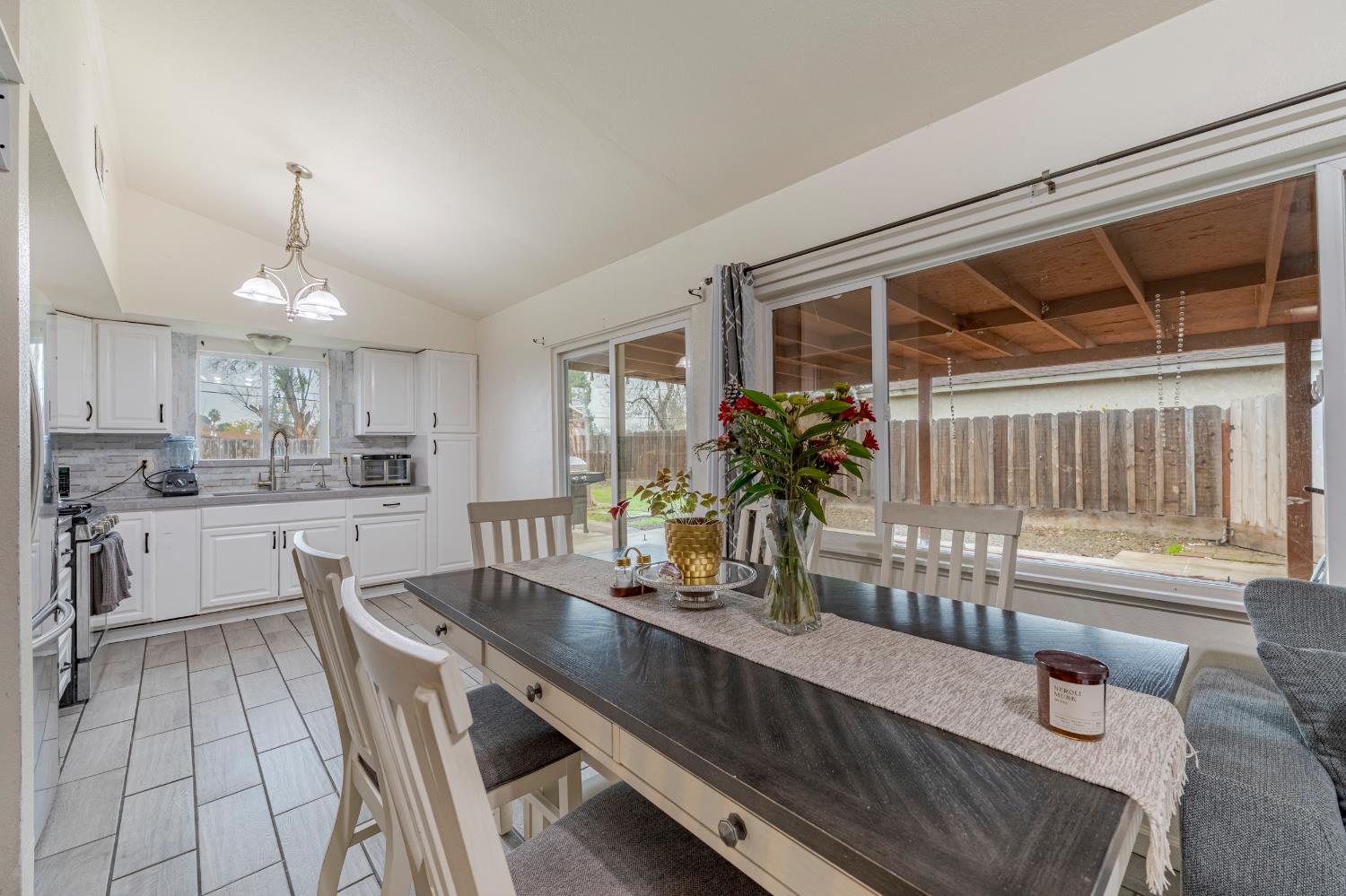 1595 East 26th Street Merced, CA 95340 - Photo 11 of 34 a dining room with furniture and window