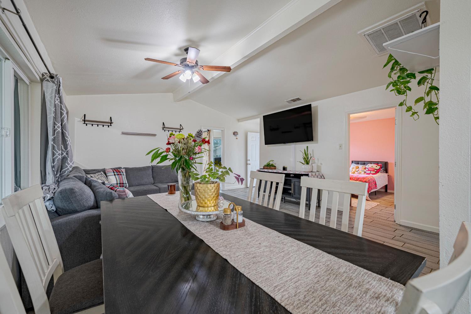 1595 East 26th Street Merced, CA 95340 - Photo 12 of 34 a living room with furniture and a flat screen tv