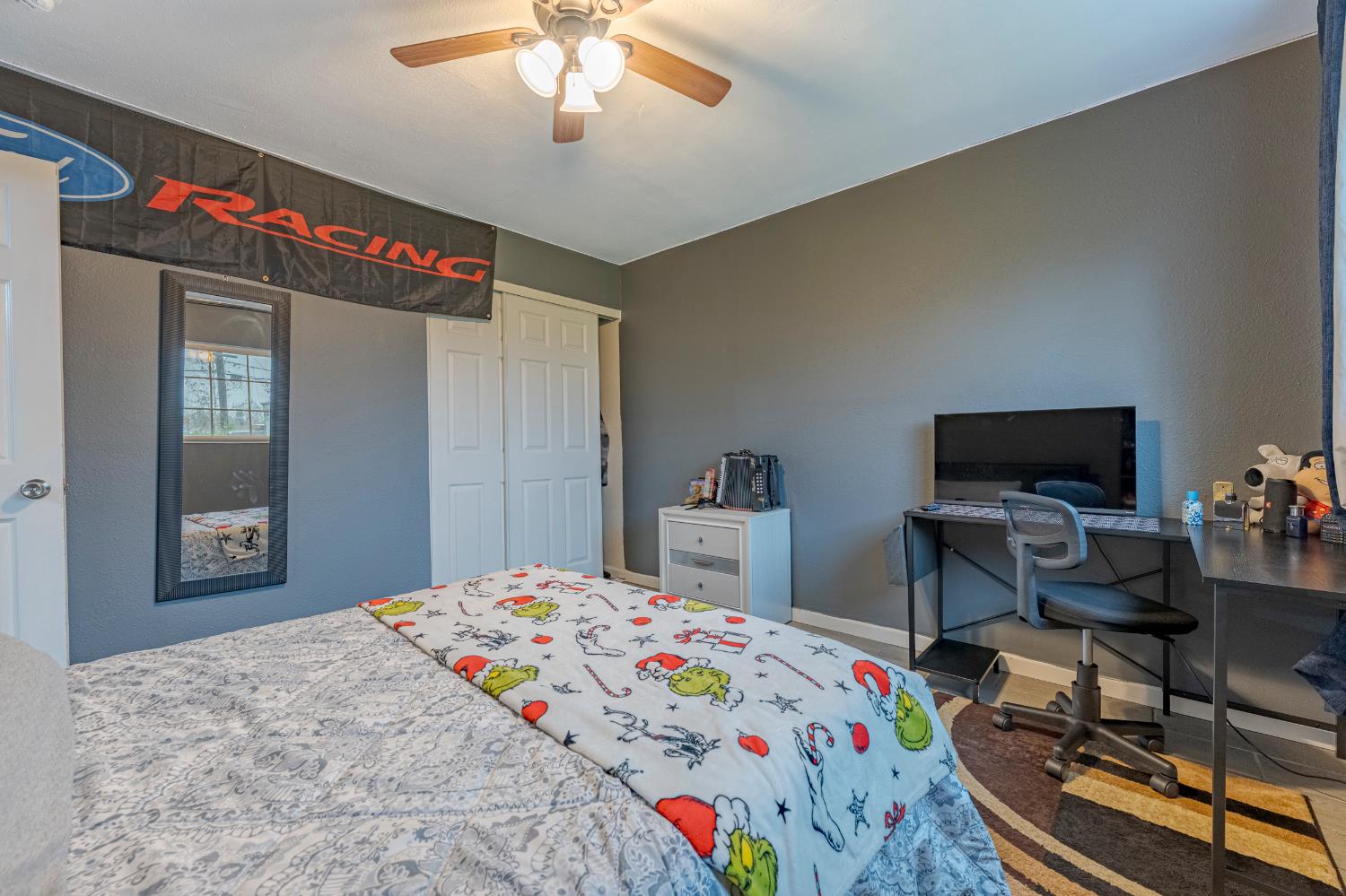 1595 East 26th Street Merced, CA 95340 - Photo 20 of 34 a bedroom that has a bed and a table in it