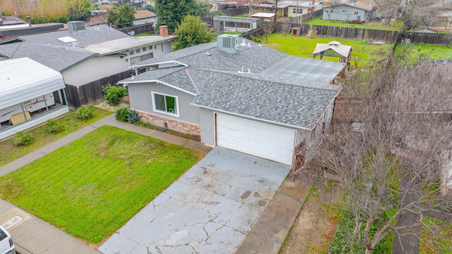 1595 East 26th Street Merced, CA 95340 - Photo 3 of 34 an aerial view of a house with a swimming pool