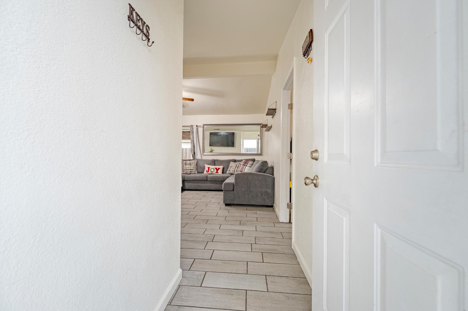 1595 East 26th Street Merced, CA 95340 - Photo 7 of 34 a bathroom with a sink and a mirror