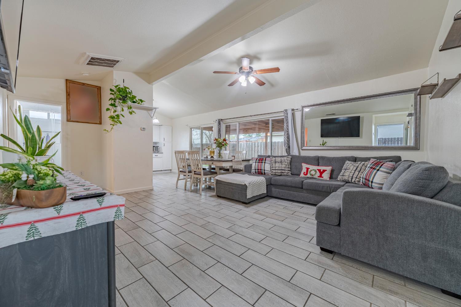 1595 East 26th Street Merced, CA 95340 - Photo 8 of 34 a living room with furniture and a potted plant