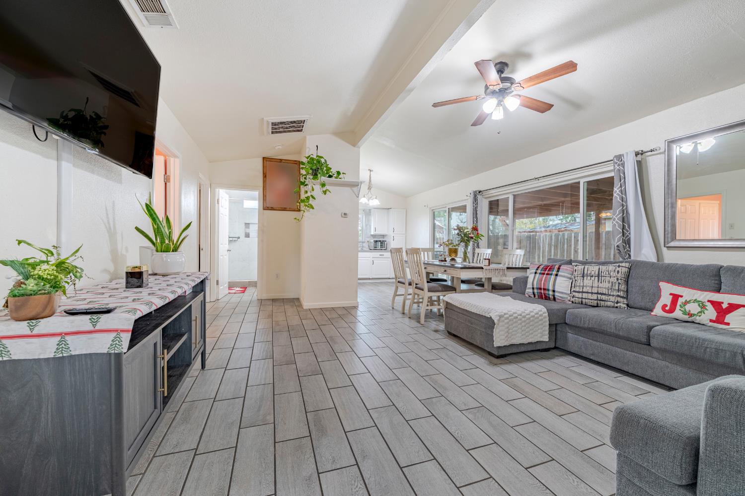 1595 East 26th Street Merced, CA 95340 - Photo 9 of 34 a living room with furniture and a flat screen tv