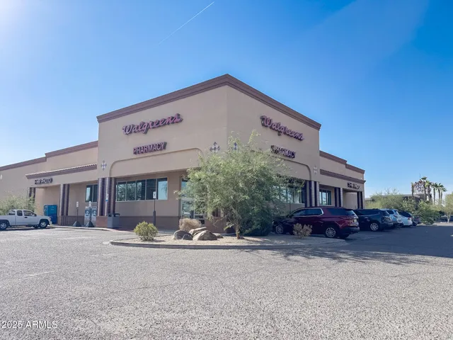 a front view of a building with sitting area