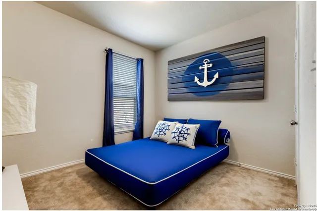 a bed room with a bed and a window