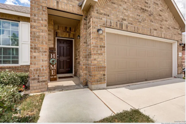a front view of a house with a garage