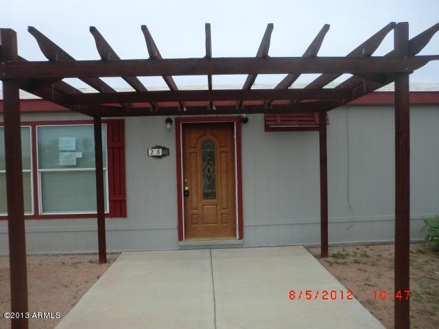 284 North Tomahawk Road Apache Junction, AZ 85119 - Photo 3 of 30 a view of a room with wooden floor
