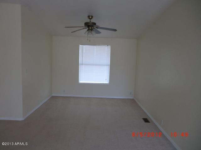 284 North Tomahawk Road Apache Junction, AZ 85119 - Photo 8 of 30 an empty room with a window