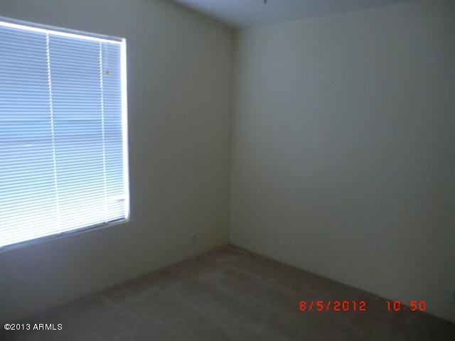 284 North Tomahawk Road Apache Junction, AZ 85119 - Photo 9 of 30 a room that has a window in it