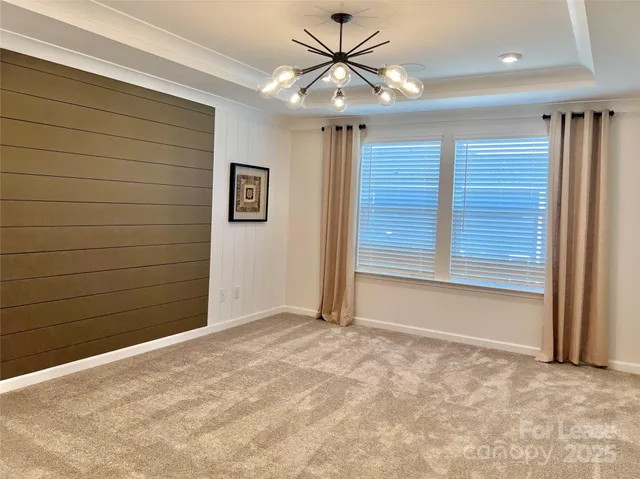 a view of room with hardwood floor and ceiling fan