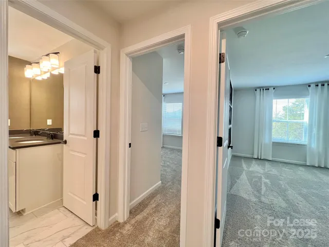 a view of a bathroom with a shower and a sink