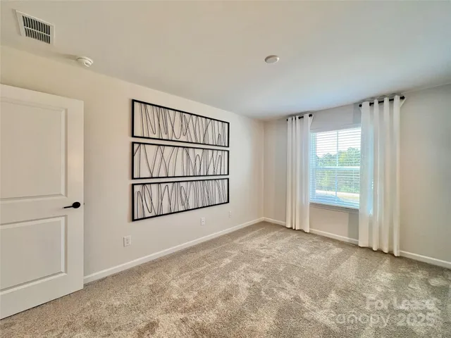 a view of wooden floor and windows in a room