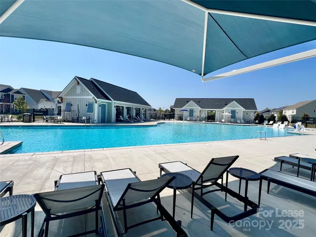 a view of a chairs and table in the patio