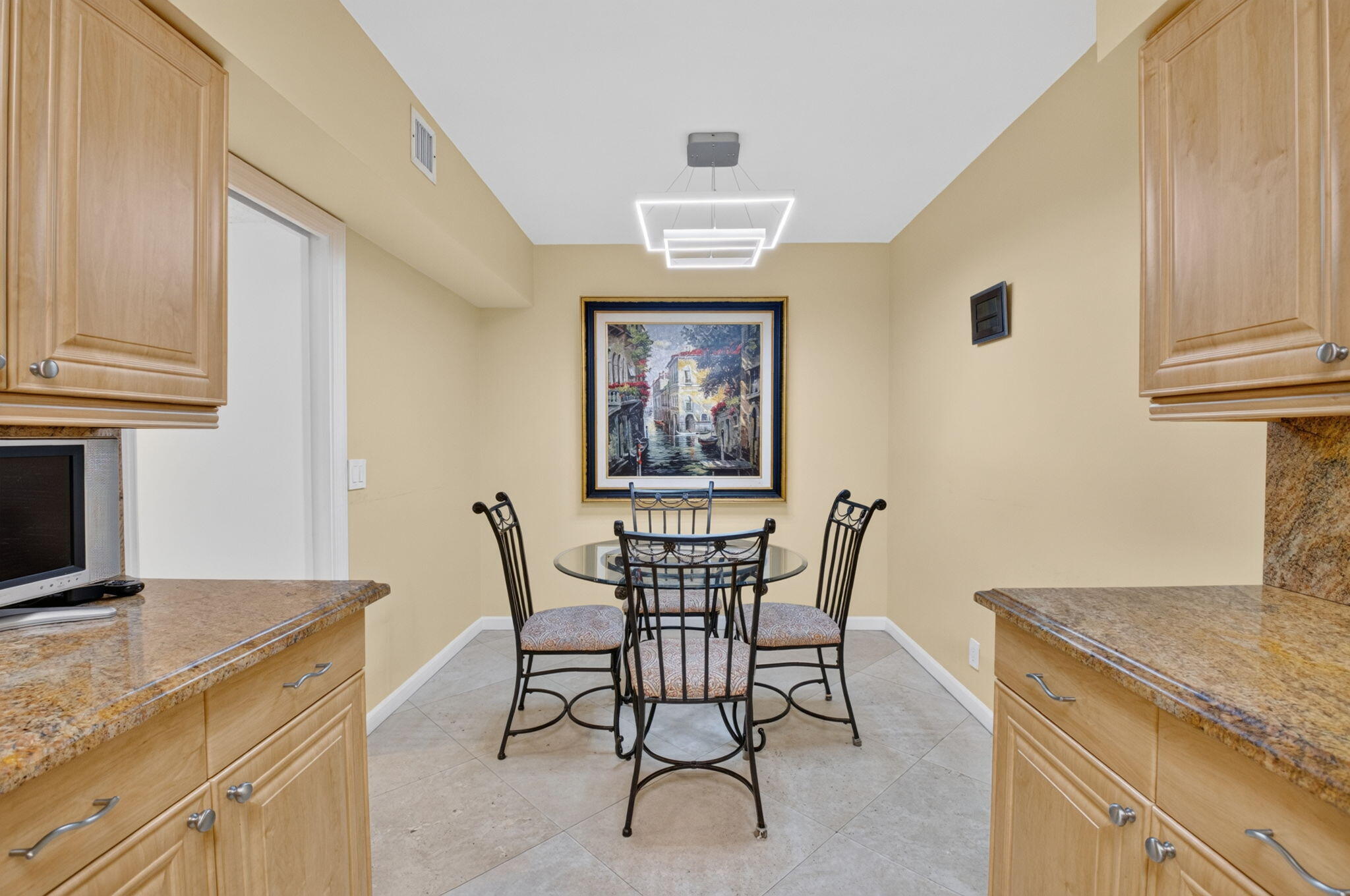 1401 South Ocean Boulevard, Unit 1060 Boca Raton, FL 33432 - Photo 11 of 46 a view of a dining room with furniture