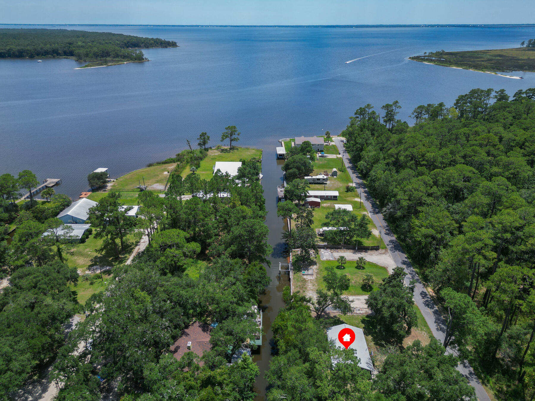an aerial view of residential house with an outdoor space and seating