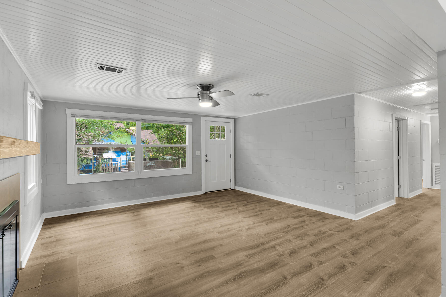771 Alaqua Drive Freeport, FL 32439 - Photo 13 of 23 an empty room with windows and fireplace