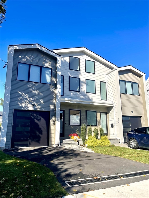 61 Allison Street, Unit 2 Newton, MA 02458 - Photo 1 of 26 a view of a white building with many windows