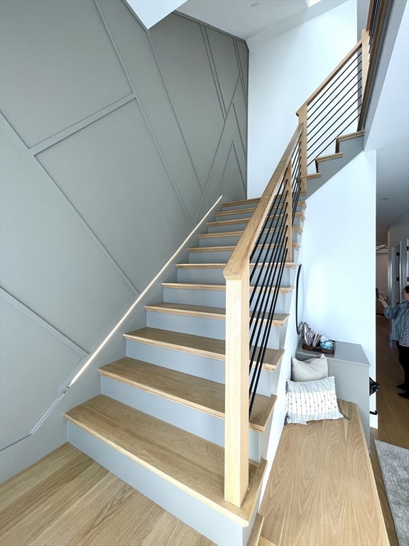 61 Allison Street, Unit 2 Newton, MA 02458 - Photo 12 of 26 a view of entryway and hall with wooden floor