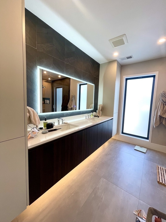 61 Allison Street, Unit 2 Newton, MA 02458 - Photo 14 of 26 a kitchen with a sink and a mirror