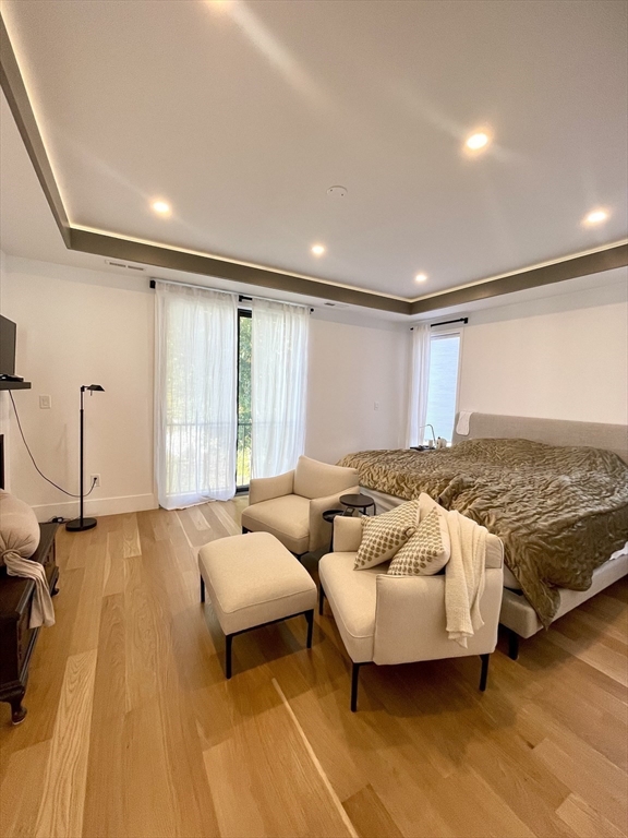 61 Allison Street, Unit 2 Newton, MA 02458 - Photo 15 of 26 a spacious bedroom with a bed and window