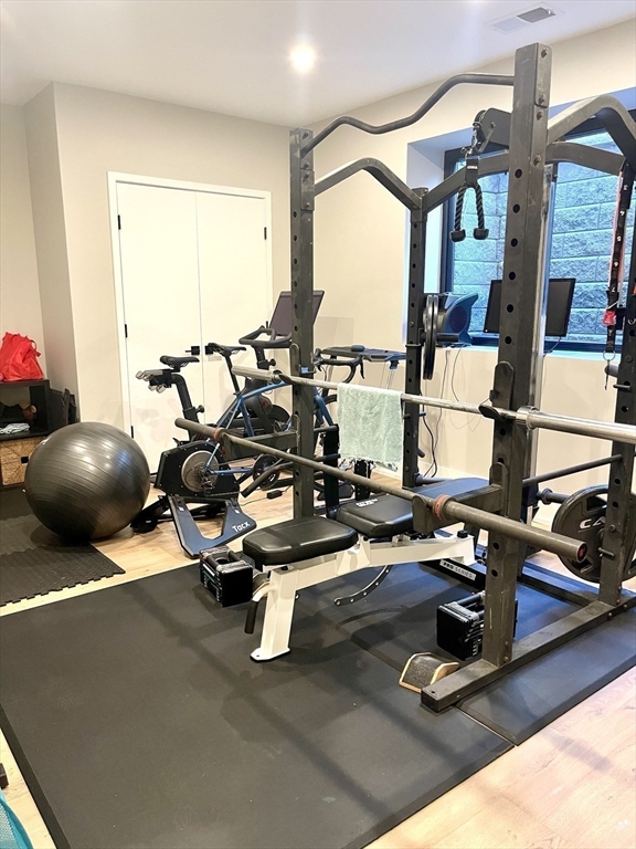 61 Allison Street, Unit 2 Newton, MA 02458 - Photo 23 of 26 a gym room with furniture and a window