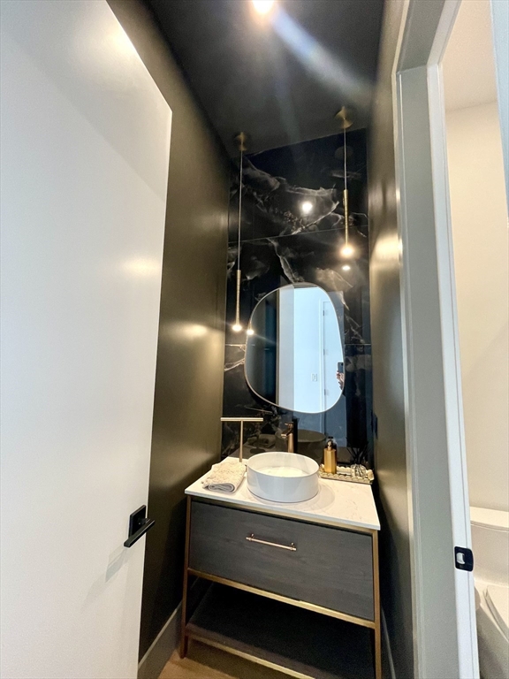 61 Allison Street, Unit 2 Newton, MA 02458 - Photo 8 of 26 a room with water heater and utility room