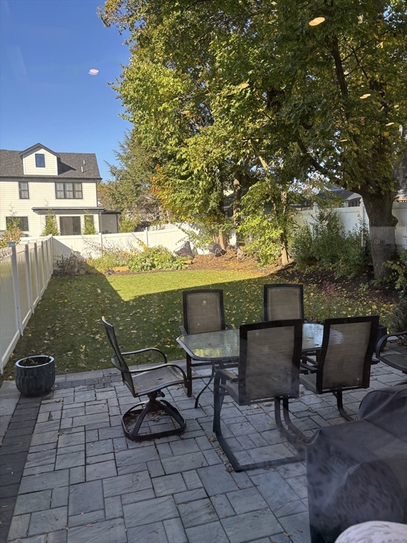 61 Allison Street, Unit 2 Newton, MA 02458 - Photo 9 of 26 a view of a chairs and table in patio