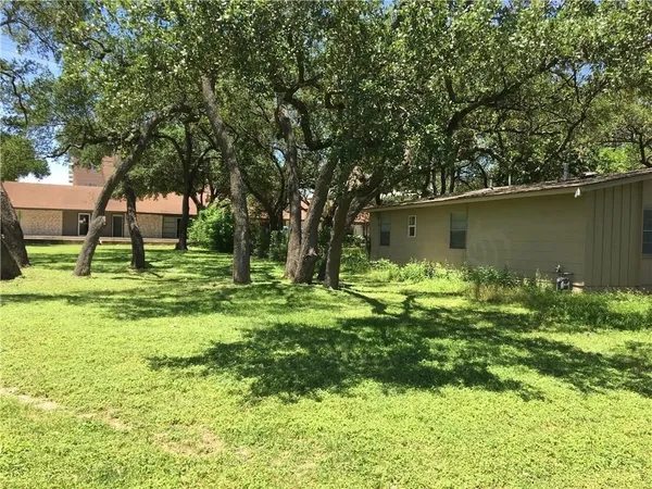 a backyard of a house with lots of green space