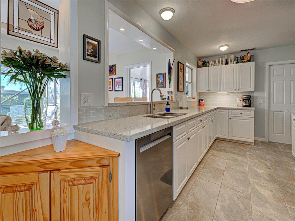 1350 Lakeside Drive Venice, FL 34293 - Photo 13 of 64 a kitchen with a sink and cabinets