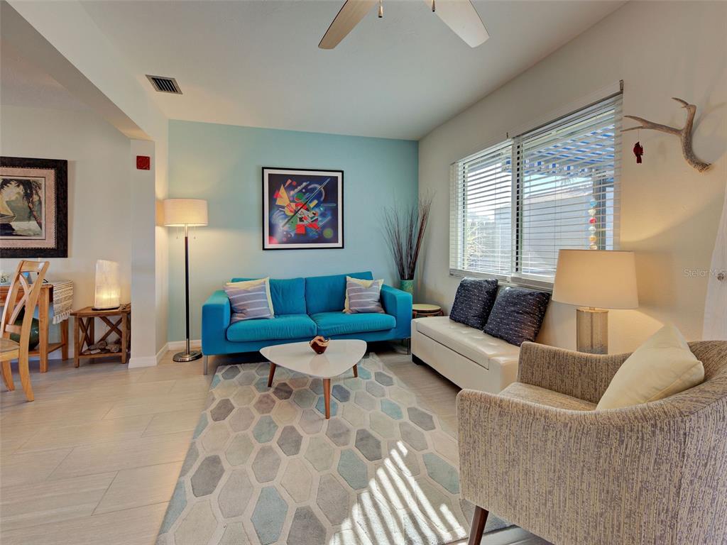 1350 Lakeside Drive Venice, FL 34293 - Photo 20 of 64 a living room with furniture and a large window